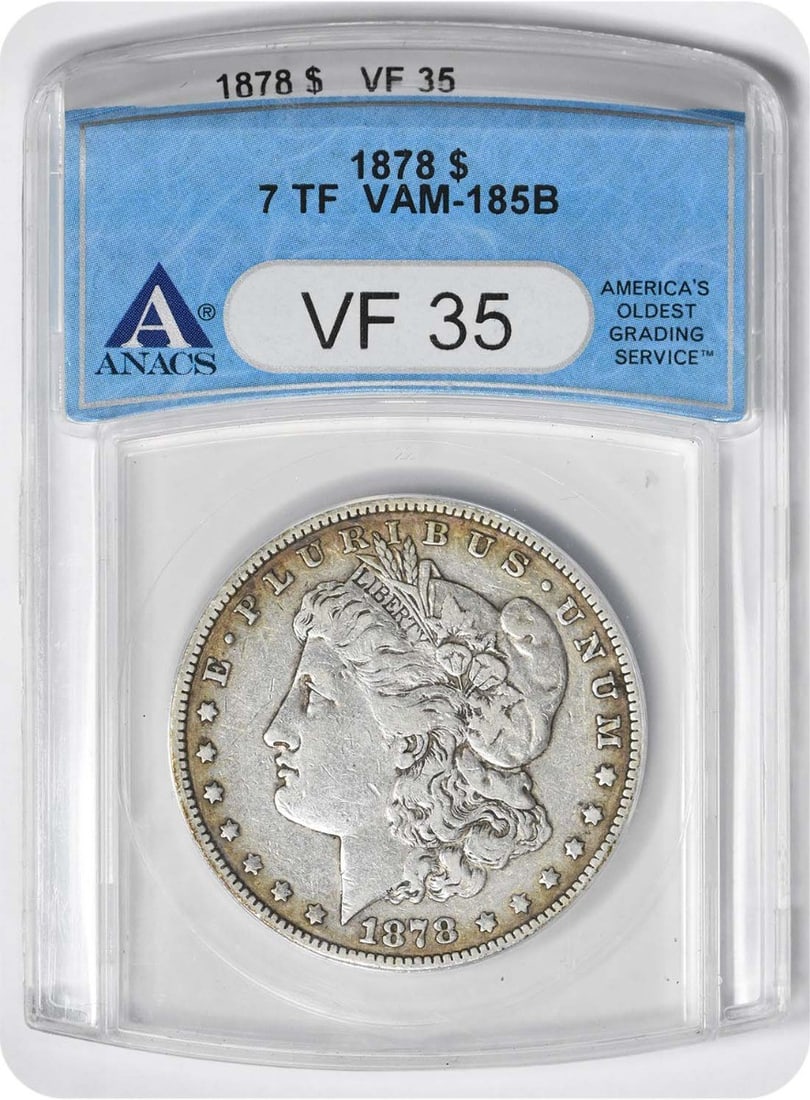 1878 7TF VAM 185B Morgan Silver Dollar VF35 ANACS: 1878 7TF VAM 185B Morgan Silver Dollar VF35 ANACS 1878 7TF VAM 185B Morgan Silver Dollar VF35 ANACS - A circulated 1878 Morgan dollar with a notable VAM (Variety According to the Mint) designation,