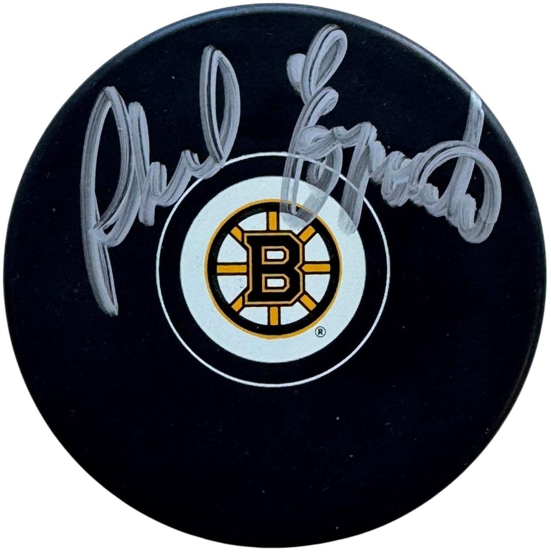 Phil Esposito Autographed Bruins Official Puck (JSA): Phil Esposito Autographed Bruins Official Puck (JSA) Authentic Phil Esposito signed Bruins official puck, bearing his signature in silver sharpie across the front. This officially licensed item is a