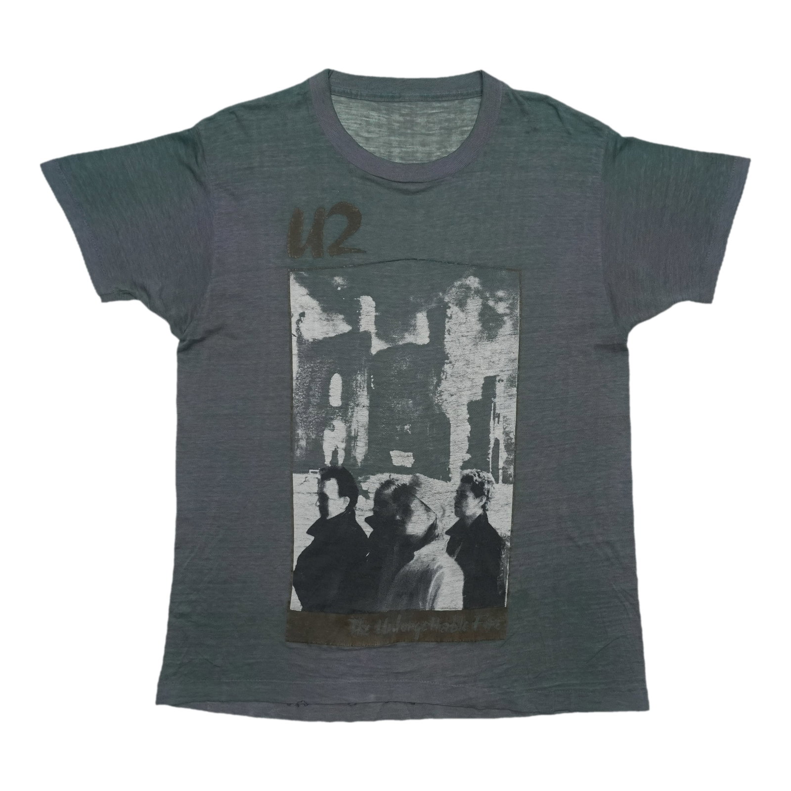 1985 U2 The Unforgettable Fire Tour Shirt: 1985 U2 The Unforgettable Fire Tour Shirt Grey 1985 U2 The Unforgettable Fire Tour Shirt, featuring the iconic design from one of the band's most memorable tours. This vintage shirt has been washed