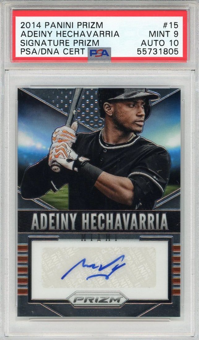 Adeiny Hechavarria Autographed 2014 Panini Prizm Card #15 (PSA 9/ 10): Adeiny Hechavarria Autographed 2014 Panini Prizm Card #15 (PSA 9/ 10) Adeiny Hechavarria's 2014 Panini Prizm Card #15 features his sharpie signature across the front, a unique touch that adds to its