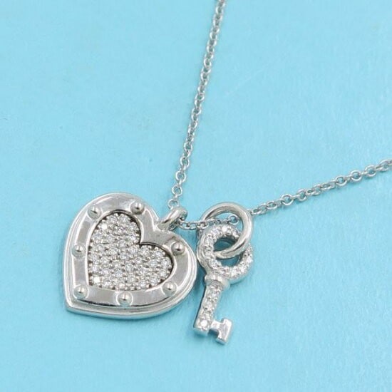Tiffany & Co Return to Love Diamond 18k White Gold Heart Tag Lock Key Necklace: Tiffany & Co Return to Love Diamond 18k White Gold Heart Tag Lock Key Necklace Item Specifics: Pendant Shape: Heart Key Closure: Spring Ring Occasion: Anniversary Birthday Christening Christmas Confir