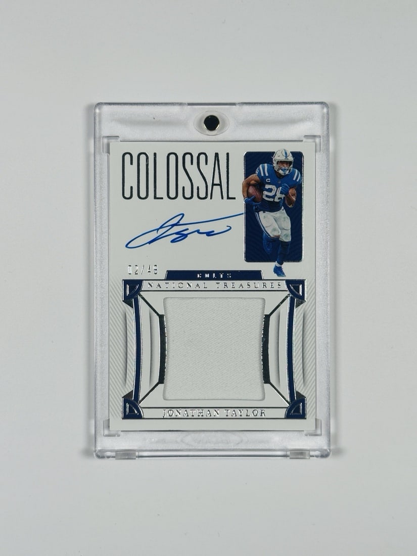 2022 PANINI NATIONAL TREASURES JONATHAN TAYLOR #CS-JTA COLOSSAL PATCH AUTO/ 49: 2022 PANINI NATIONAL TREASURES JONATHAN TAYLOR #CS-JTA COLOSSAL PATCH AUTO/ 49 CS-JTA #49 features an impressive colossal patch auto from Jonathan Taylor, a hard-signed print with a limited run of