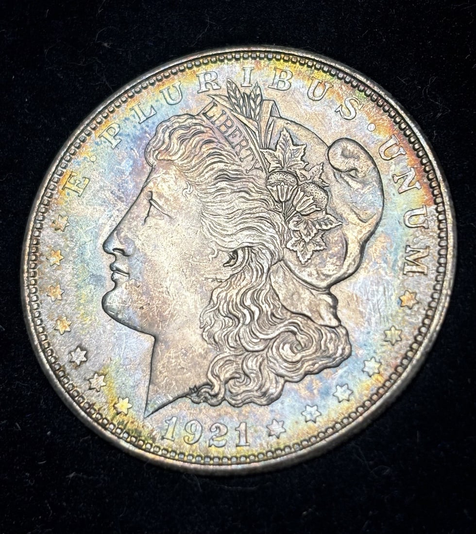 Morgan Dollar Uncirculated Pretty Rainbow Toning: Morgan Dollar Uncirculated Pretty Rainbow Toning The 1921 Morgan Dollar features a unique blend of historical significance and aesthetic appeal, with its circulated condition showcasing a subtle