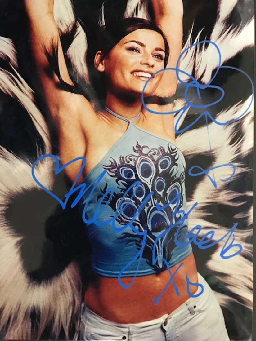 Celebrity Photo By Nelly Furtado Autographed 8x10: Celebrity Photo By Nelly Furtado Autographed 8x10 Nelly Furtado's 8x10 celebrity photo bears her signature in blue sharpie across the front. This rare and unique piece offers a glimpse into the life