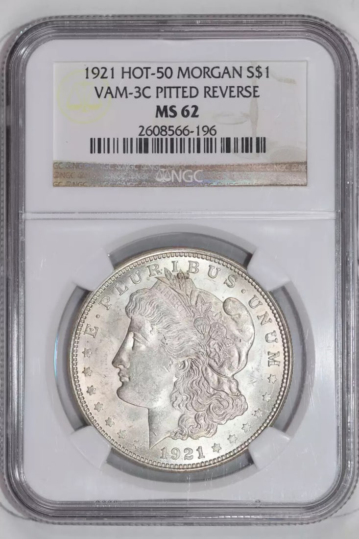 1921 MORGAN VAM-3C PITTED REVERSE HOT 50 MORGAN DOLLAR NGC MS62: 1921 MORGAN VAM-3C PITTED REVERSE HOT 50 MORGAN DOLLAR NGC MS62 The 1921 Morgan dollar, graded MS62 by the Numismatic Guaranty Corporation (NGC), boasts a striking pitted reverse, adding visual