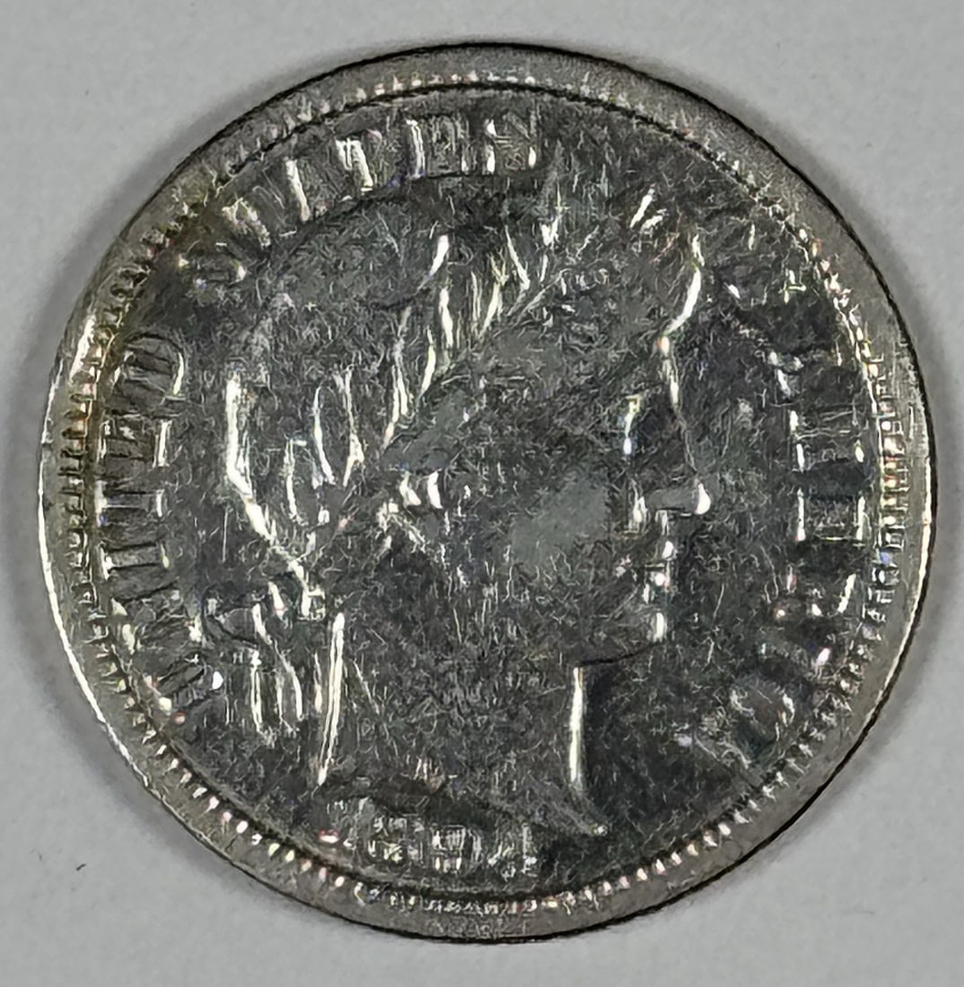 1894-O BARBER DIME XF/ AU DETAILS: 1894-O BARBER DIME XF/ AU DETAILS The 1894-O Barber dime, with its distinctive mint mark and classic design, is a rare find for collectors. This circulated coin features XF/AU details, showcasing its