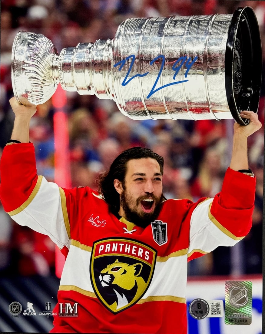 Ryan Lomberg Autographed Panthers 8x10 Raising Stanley Cup (Beckett Witness): Ryan Lomberg Autographed Panthers 8x10 Raising Stanley Cup (Beckett Witness) Ryan Lomberg's blue paint pen signature adds a unique touch to this 8x10 photo of the Panthers raising the Stanley Cup.