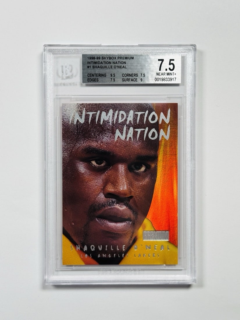 SKYBOX PREMIUM O'NEAL SHAQUILLE #1 INTIMIDATION NATION BGS 7.5: SKYBOX PREMIUM O'NEAL SHAQUILLE #1 INTIMIDATION NATION BGS 7.5 Standard Autographed Card from the 1998 Skybox Premium Intimidation Nation Set, Featuring Shaquille O'Neal in Action. This card showcases