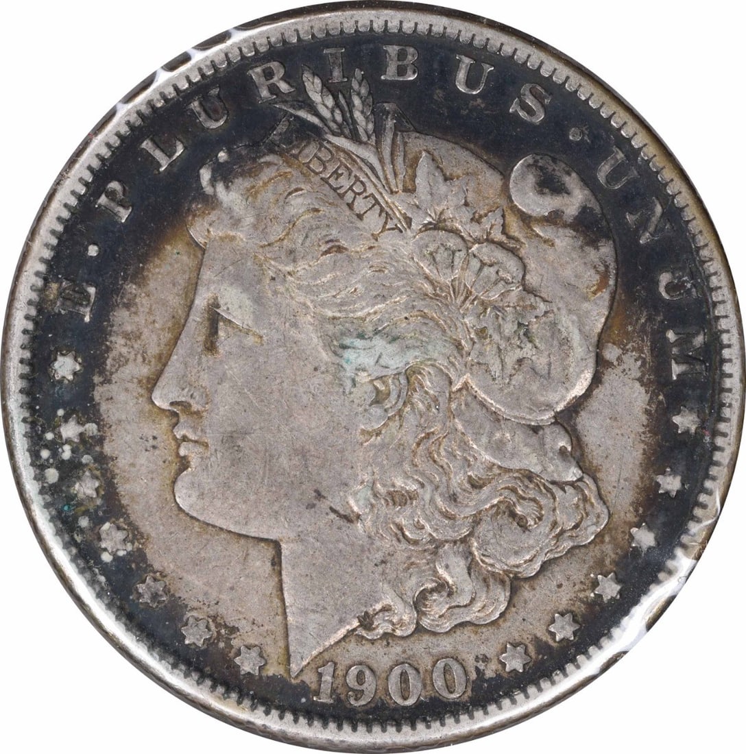 1900-O/ CC Morgan Silver Dollar EF Uncertified: 1900-O/ CC Morgan Silver Dollar EF Uncertified EF Uncertified Circulated Morgan Silver Dollar, minted in 1900 with an 'O' mint mark, showcases its 90% silver composition and reeded edge. This