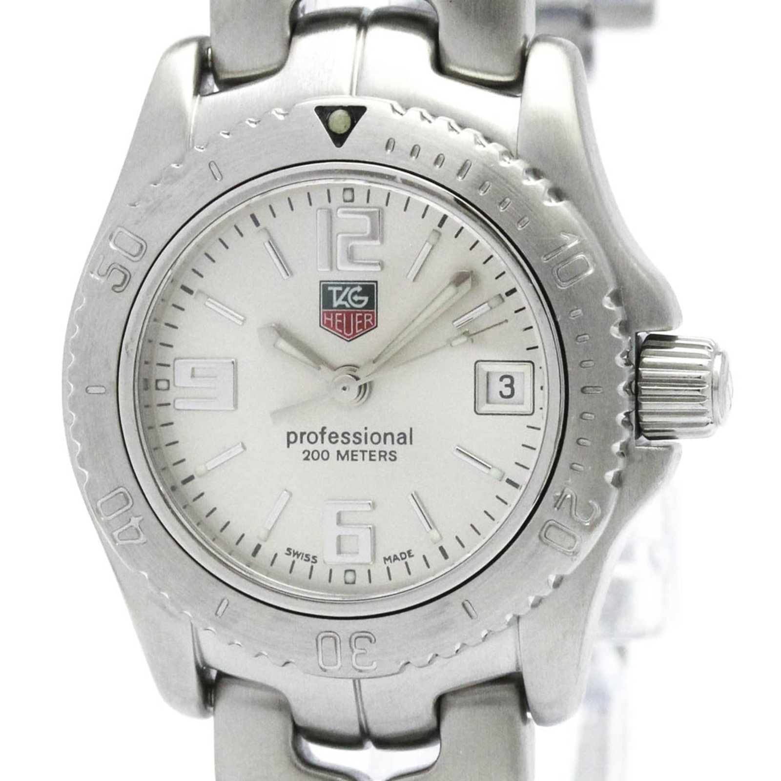Tag Heuer Wristwatch: Tag Heuer Wristwatch Stainless steel case and band add a sleek touch to this silver dial Tag Heuer wristwatch, measuring 26mm in diameter. The watch boasts a dress/formal style that's perfect for