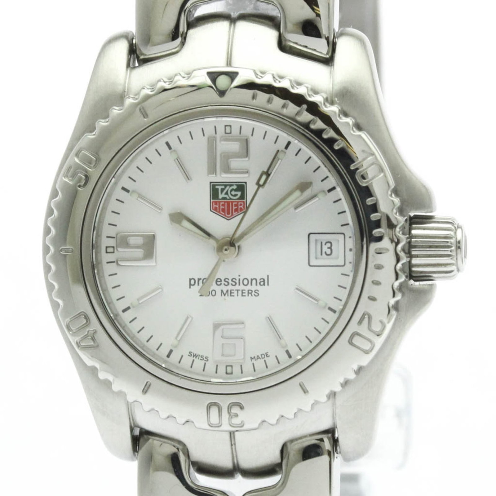 Tag Heuer Wristwatch: Tag Heuer Wristwatch Stainless steel case and band provide a sleek, sporty look for the Tag Heuer wristwatch. The white dial stands out against the metallic background, adding a touch of elegance to t