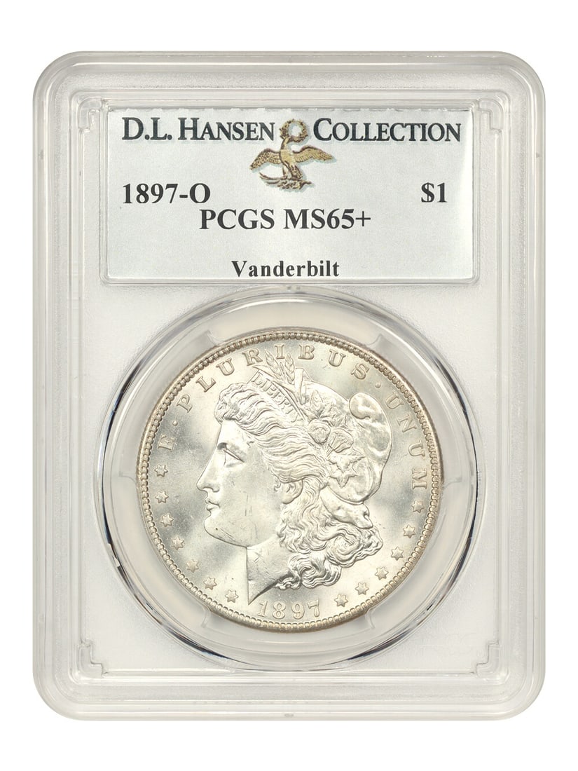 1897-O $1 PCGS MS65+ ex: Vanderbilt/ D.L. Hansen: 1897-O $1 PCGS MS65+ ex: Vanderbilt/ D.L. Hansen The 1897-O $1, graded MS65+, boasts an exceptional level of detail and luster, showcasing the characteristic beauty of a well-preserved Morgan Dollar. 