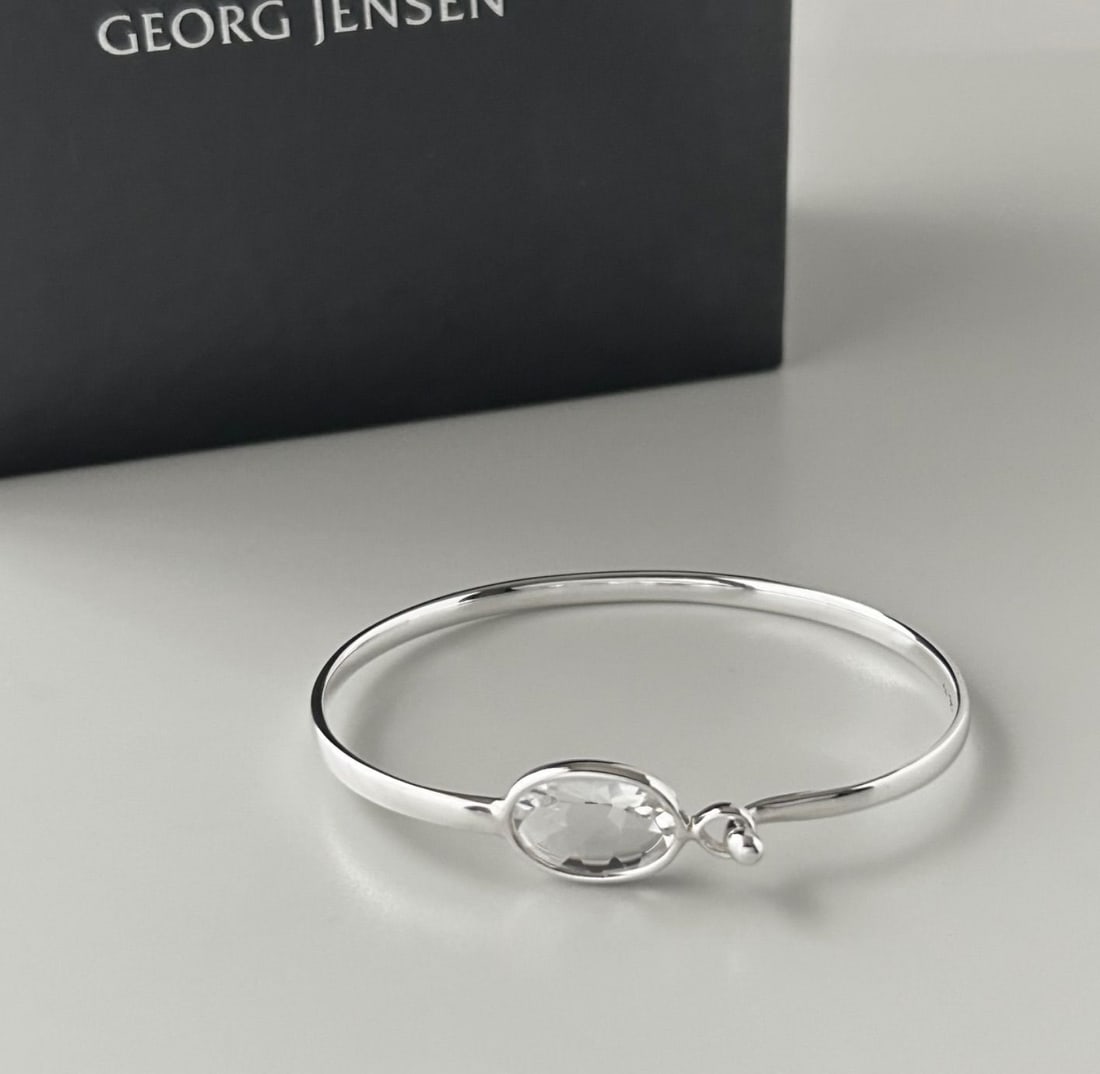 Sterling silver with rock crystal bracelet bangle box from Georg Jensen Savannah: Sterling silver with rock crystal bracelet bangle box from Georg Jensen Savannah Item Specifics: Color: Silver Main Stone Color: Clear Material: Metal Metal: Sterling Silver Main Stone: Crystal