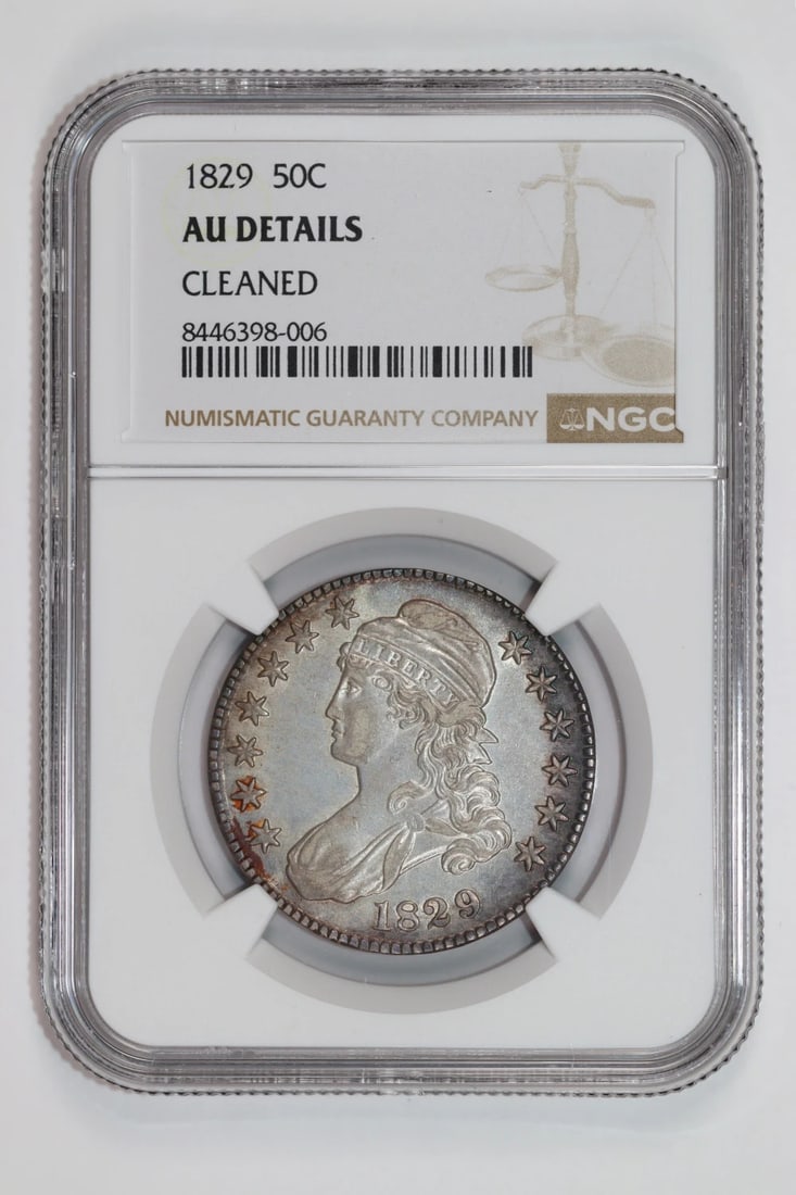 1829 CAPPED BUST HALF DOLLAR NGC AU DETAILS: 1829 CAPPED BUST HALF DOLLAR NGC AU DETAILS The 1829 Capped Bust Half Dollar features a striking design with a prominent bust and detailed engravings, set against a silver background. Certified by the