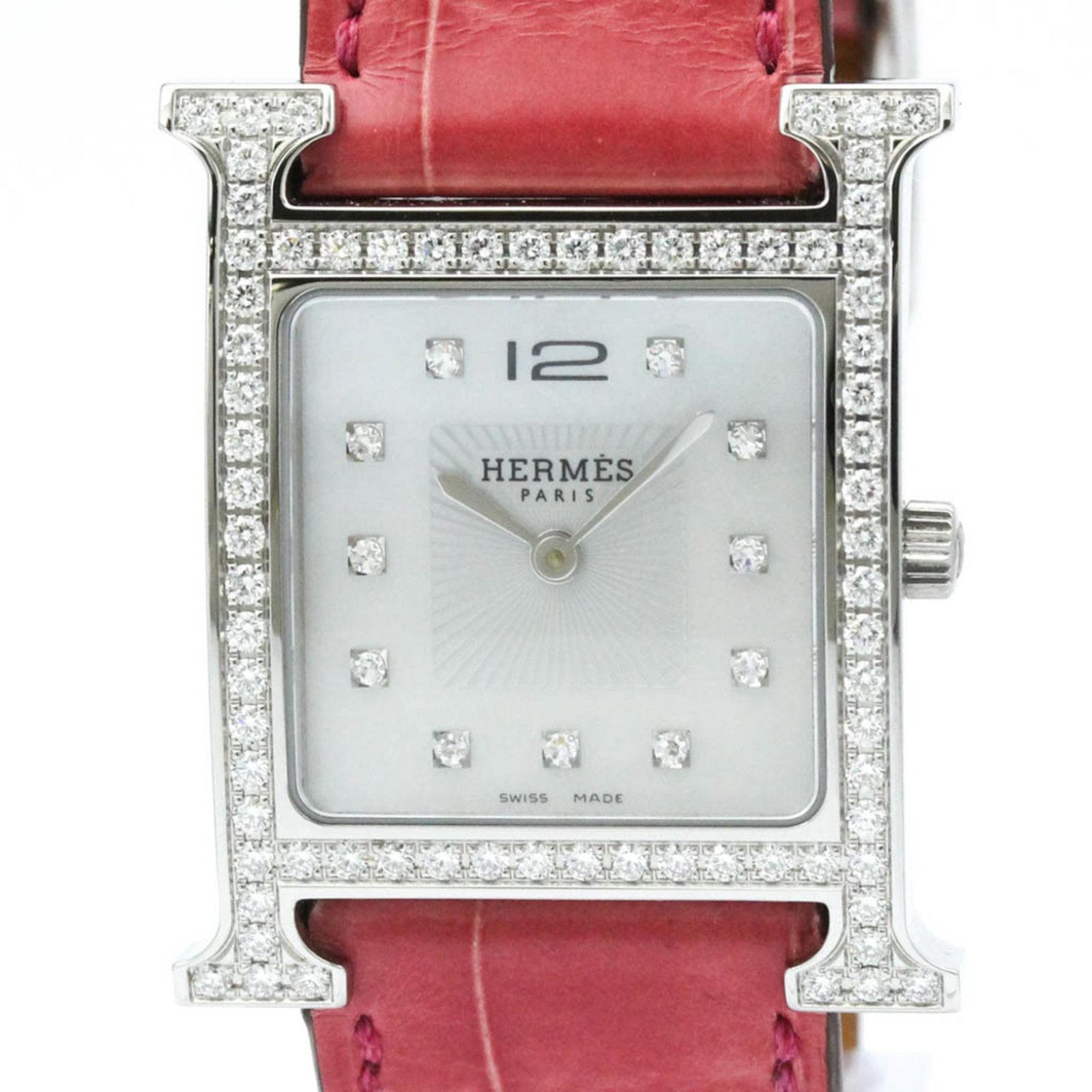 Hermes Wristwatch: Hermes Wristwatch Stainless steel case with a classic white dial, this Hermes wristwatch exudes timeless elegance. With its 27mm diameter and leather band, it's perfect for dressing up any formal occa