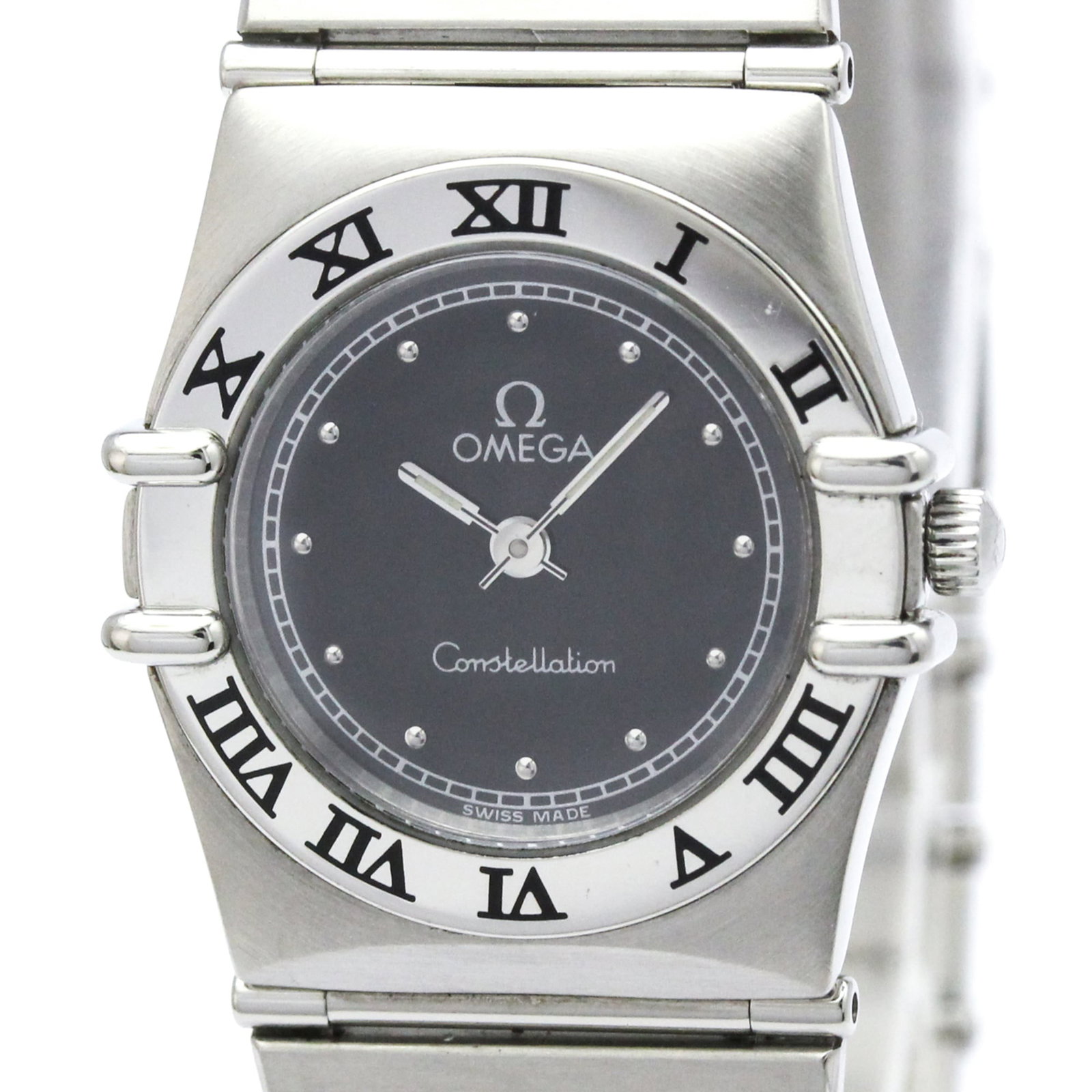 Omega Wristwatch: Omega Wristwatch Stainless steel case and band provide a sleek, modern look for the Omega wristwatch. The black dial stands out against the subtle wear and minor scratches that give this used watch it