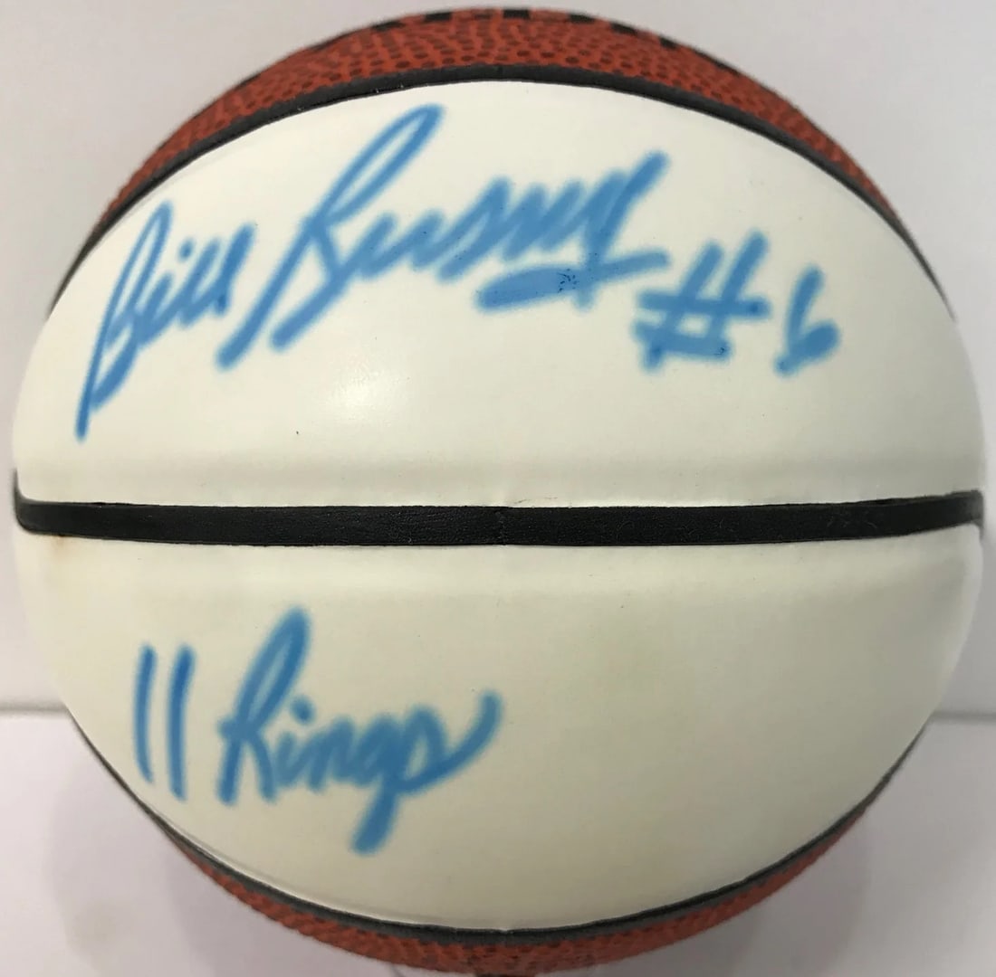 Spalding Mini Basketball Autographed By Bill Russell: Spalding Mini Basketball Autographed By Bill Russell Signed in blue sharpie across the white panel, Bill Russell adds his personal touch to this Spalding Mini Basketball. The inscription "11 Rings" se