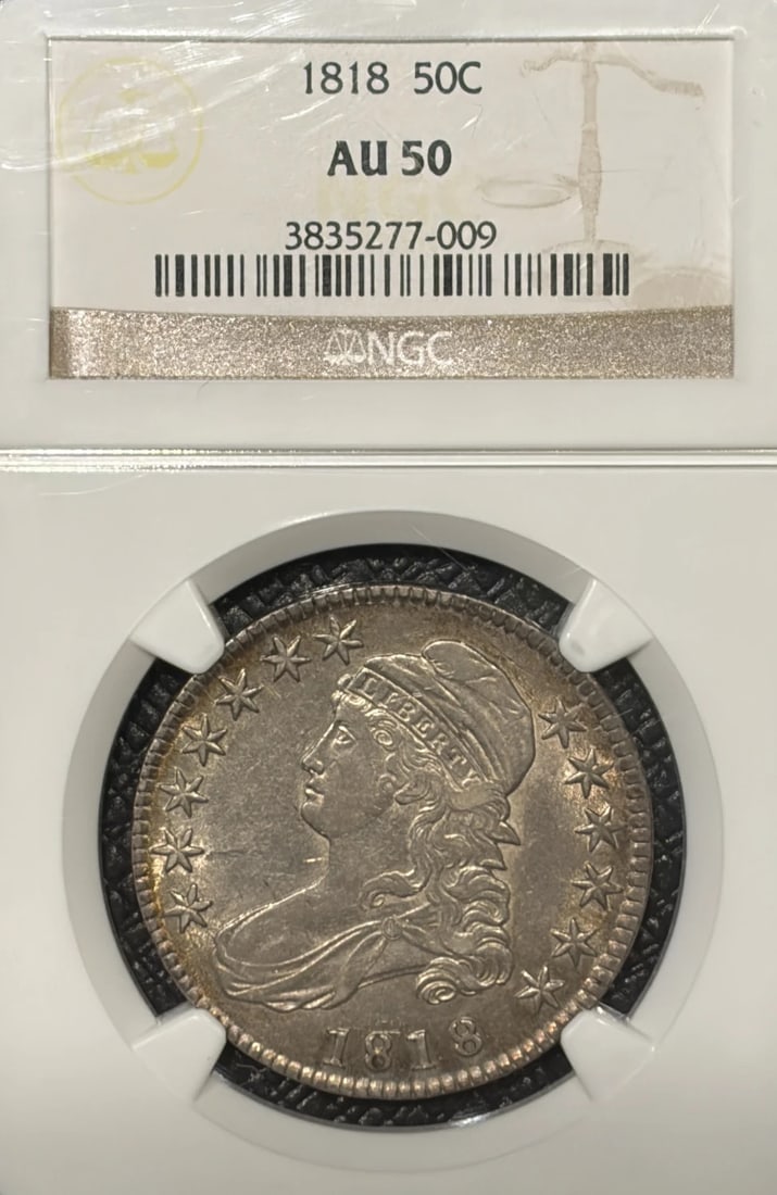 AU50 NGC BUST 1818 HALF DOLLAR: AU50 NGC BUST 1818 HALF DOLLAR The AU50 NGC BUST 1818 HALF DOLLAR features a striking design from the early 19th century, with its distinctive bust portrait and detailed engravings. Certified by the