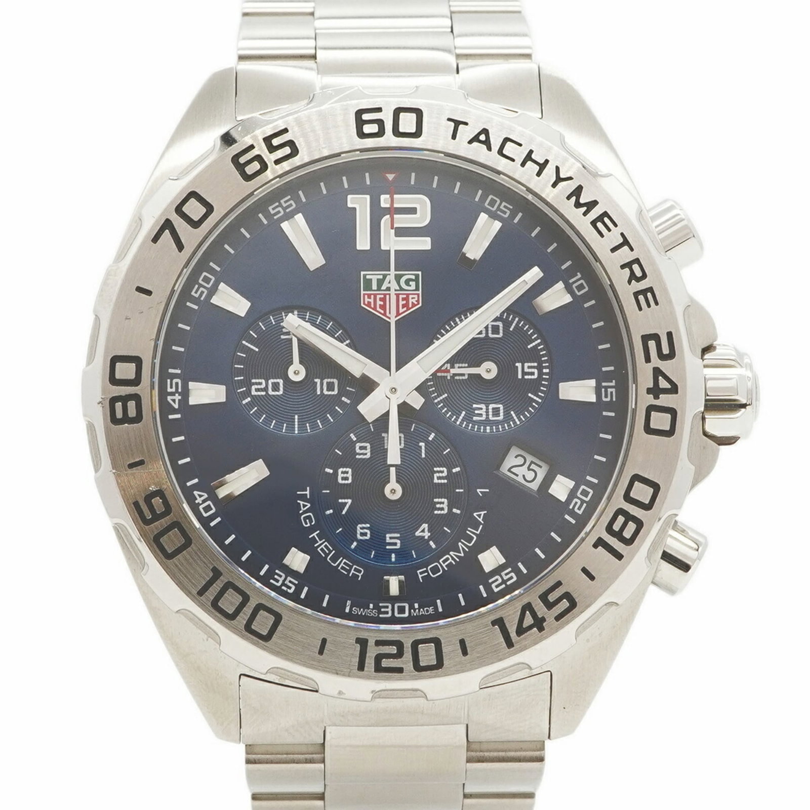 Tag Heuer Wristwatch: Tag Heuer Wristwatch Stainless steel band and navy dial make for a classic combination in this 43mm Tag Heuer wristwatch. Traces of usage are visible, with scratches and dirt present, but overall the 