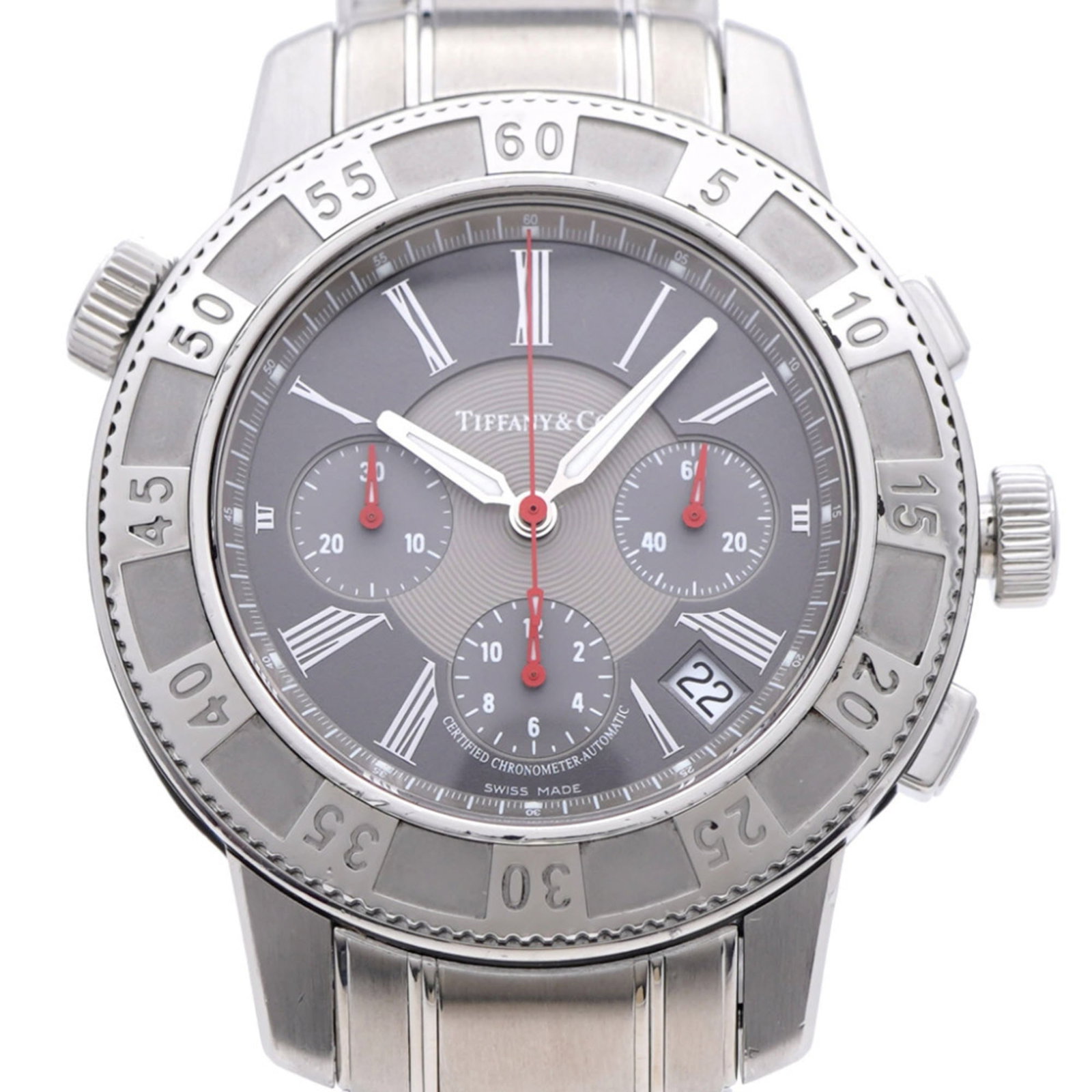 Wristwatch of Tiffany: Wristwatch of Tiffany Stainless steel case and band, the Wristwatch of Tiffany boasts a sleek gray dial. Measuring 42mm in diameter, this used timepiece bears signs of wear but remains in good conditi