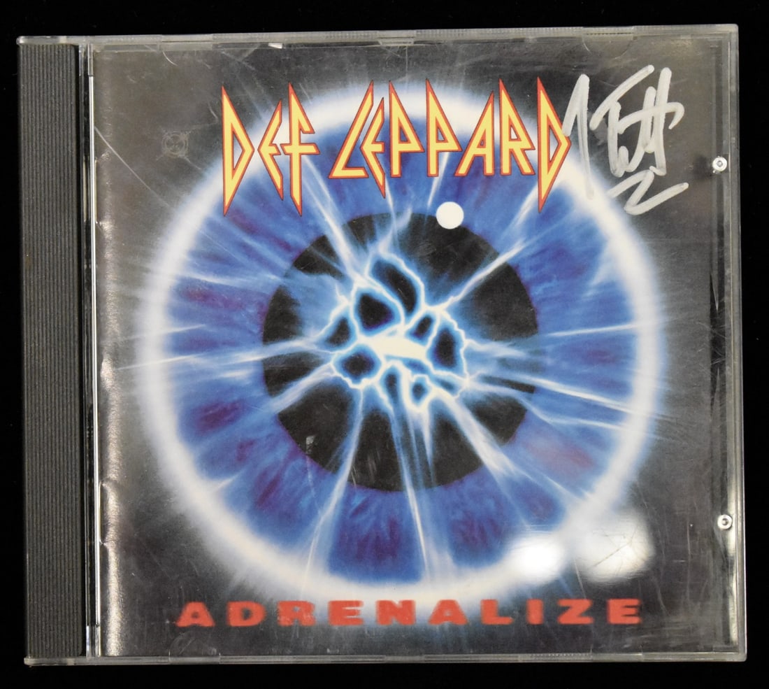 Signed Autographed Def Leppard Adrenalize CD Cover By Joe Elliott: Signed Autographed Def Leppard Adrenalize CD Cover By Joe Elliott Signed by Joe Elliott, the iconic frontman of Def Leppard, this autographed CD cover from their album 'Adrenalize' bears a