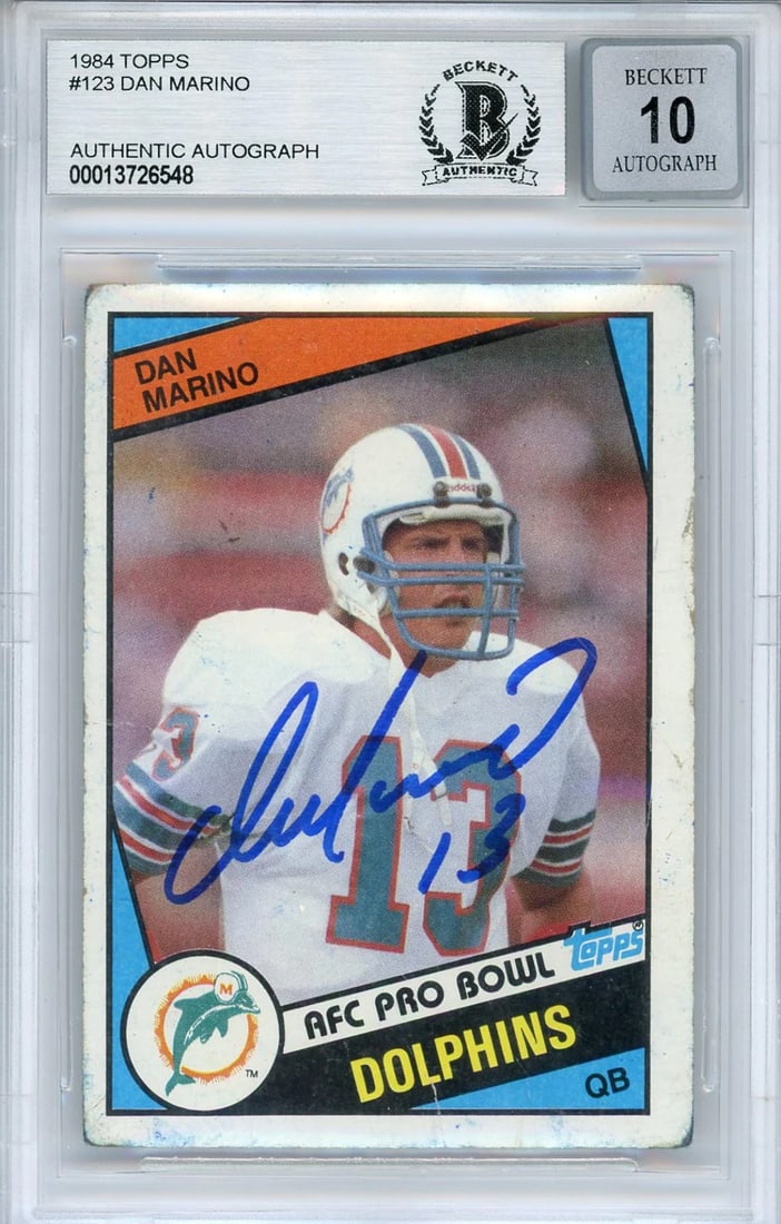 Dan Marino Autographed 1984 Topps Rookie Card #123 (Beckett Auto 10): Dan Marino Autographed 1984 Topps Rookie Card #123 (Beckett Auto 10) Authentic Dan Marino Autographed 1984 Topps Rookie Card #123, graded Gem Mint 10 by Beckett. This card features a sharpie signature