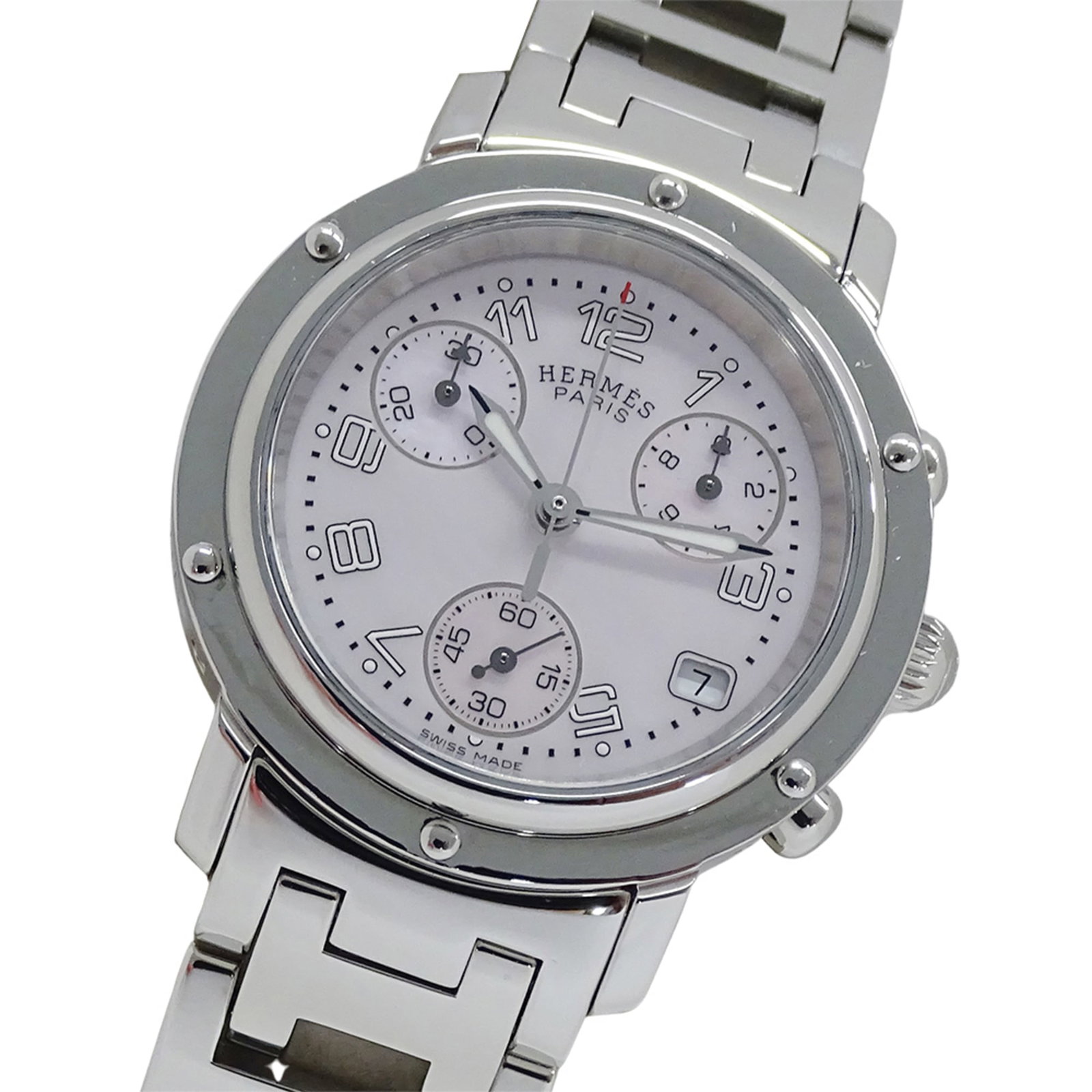 Hermes Wristwatch: Hermes Wristwatch Stainless steel case and band, pink dial, and a classic 31mm design make this Hermes wristwatch a timeless accessory. The watch has some traces of usage, scratches, and dirt, but