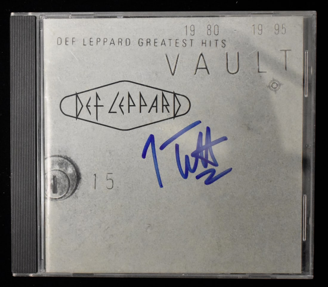 Joe Elliott Signed/ CD Greatest Hits Def Leppard Autographed Cover BA208674: Joe Elliott Signed/ CD Greatest Hits Def Leppard Autographed Cover BA208674 Joe Elliott's signature on the CD cover of Def Leppard's Greatest Hits adds a unique touch to music fans and collectors
