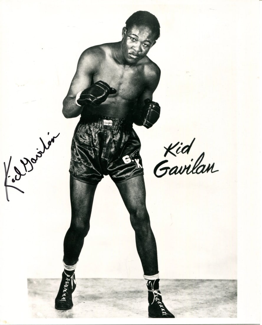 Kid Gavilan Autographed 8x10 Boxing Photo: Kid Gavilan Autographed 8x10 Boxing Photo The Kid Gavilan autographed 8x10 boxing photo features the boxer's signature in black sharpie across the front, bearing his mark. This unique piece of sports 