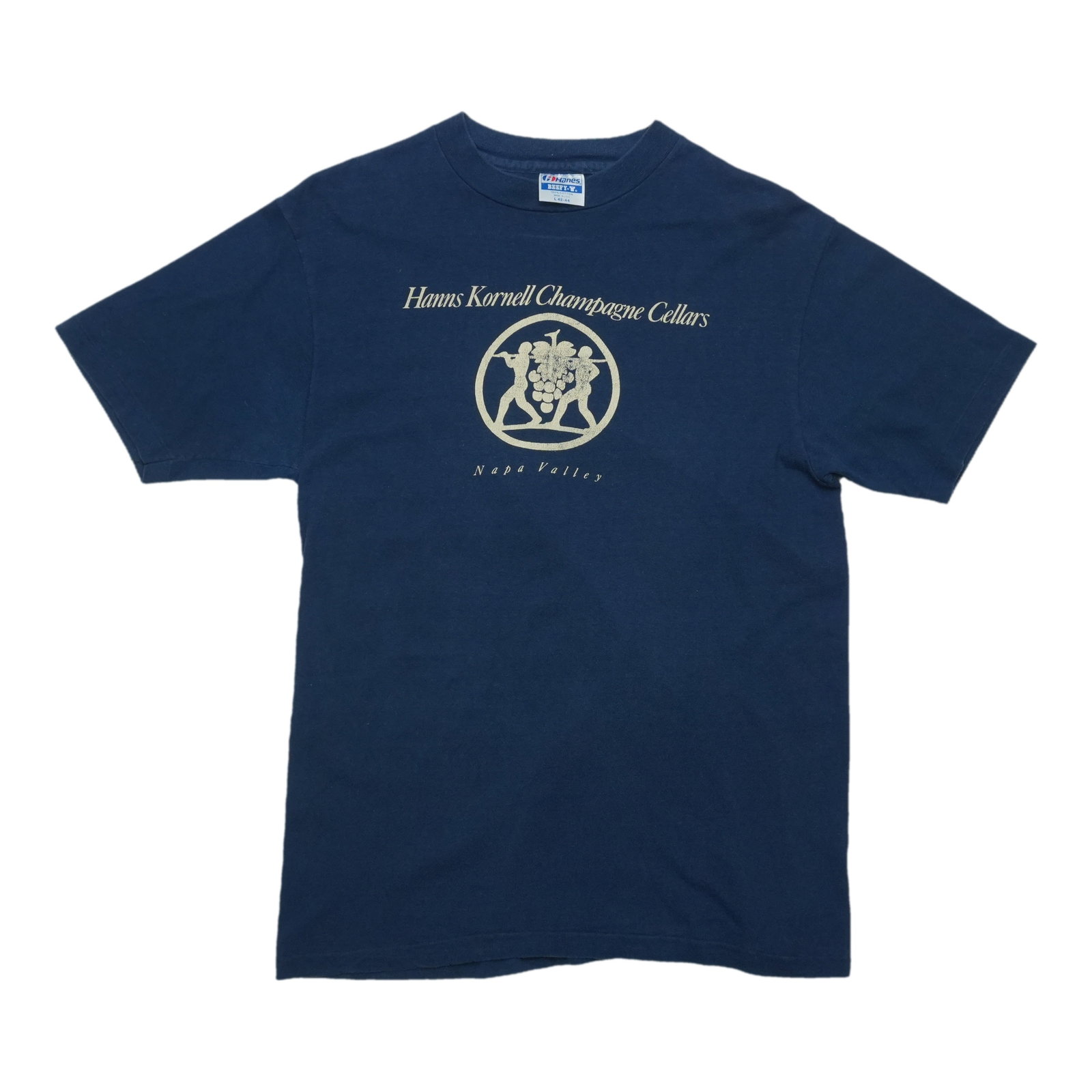 1980s Hanns Kornell Champagne Cellars Napa Valley Shirt: 1980s Hanns Kornell Champagne Cellars Napa Valley Shirt Vintage 1980s Hanns Kornell Champagne Cellars Napa Valley Shirt. This large, blue cotton shirt features a front graphic and measures pit to pit 