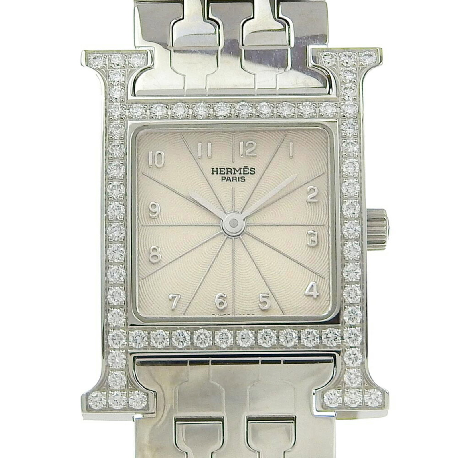 Hermes Wristwatch: Hermes Wristwatch Stainless steel case and band, silver dial, and a classic 21mm size make this Hermes wristwatch a timeless accessory. With its durable construction and sleek design, it's perfect for