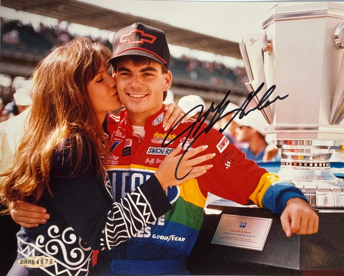 Jeff Gordon UDA Autographed 8x10 Racing Photo: Jeff Gordon UDA Autographed 8x10 Racing Photo Signed across the front in blue sharpie, this 8x10 racing photo features an unmistakable mark from NASCAR legend Jeff Gordon. The Upper Deck