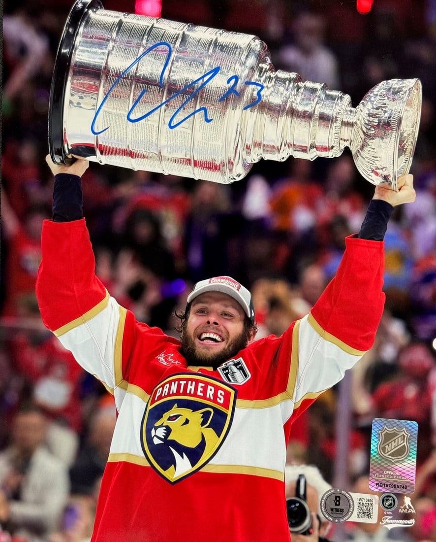 Carter Verhaeghe Autographed Panthers 8x10 Stanley Cup Raising Beckett Witness: Carter Verhaeghe Autographed Panthers 8x10 Stanley Cup Raising Beckett Witness Carter Verhaeghe's bold signature in blue paint pen adds a touch of personality to this rare 8x10 photo, featuring the