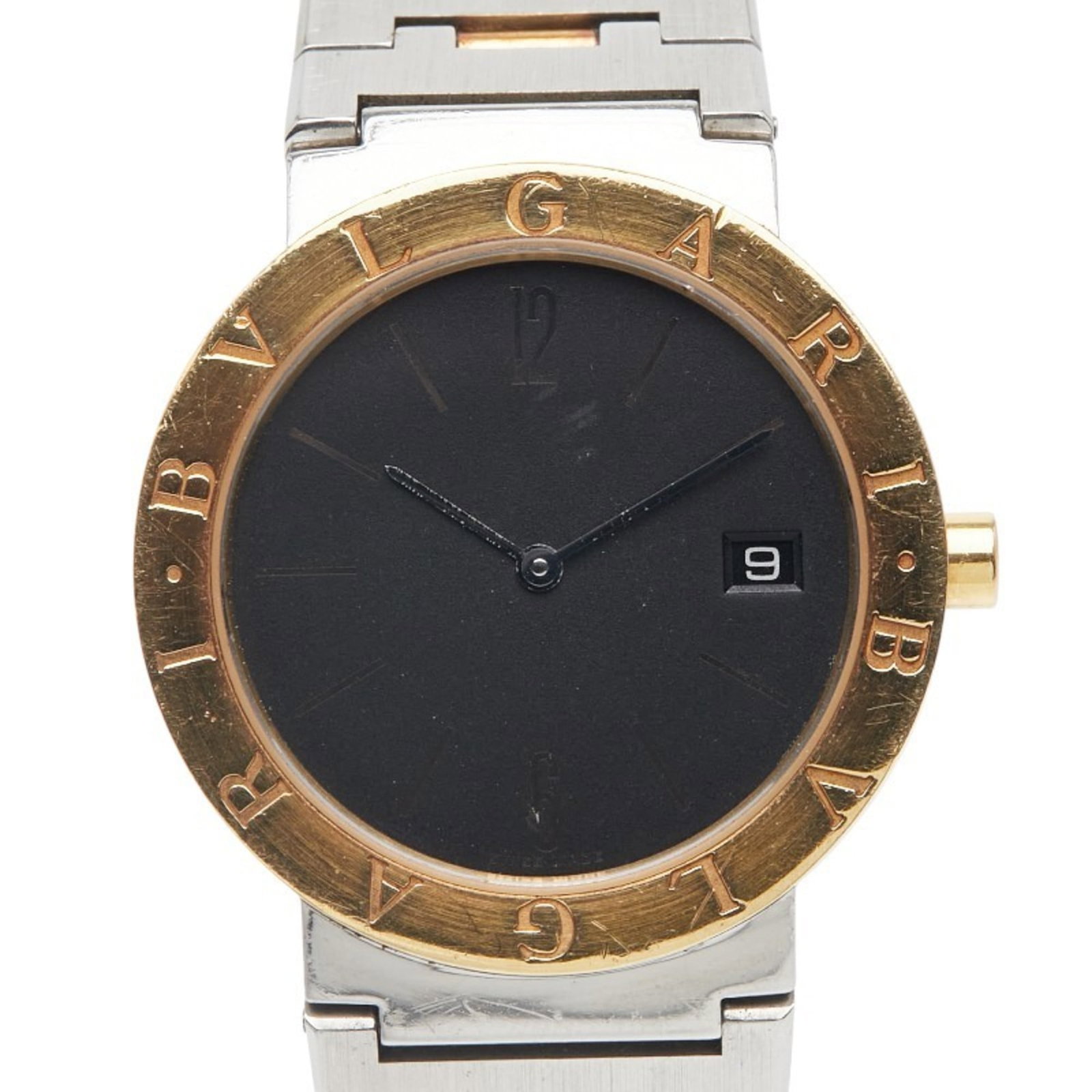 Bvlgari Wristwatch: Bvlgari Wristwatch Stainless Steel and Yellow Gold Bvlgari Wristwatch, featuring a sleek black dial and durable construction. This pre-owned timepiece boasts a classic design with a 33mm case diameter