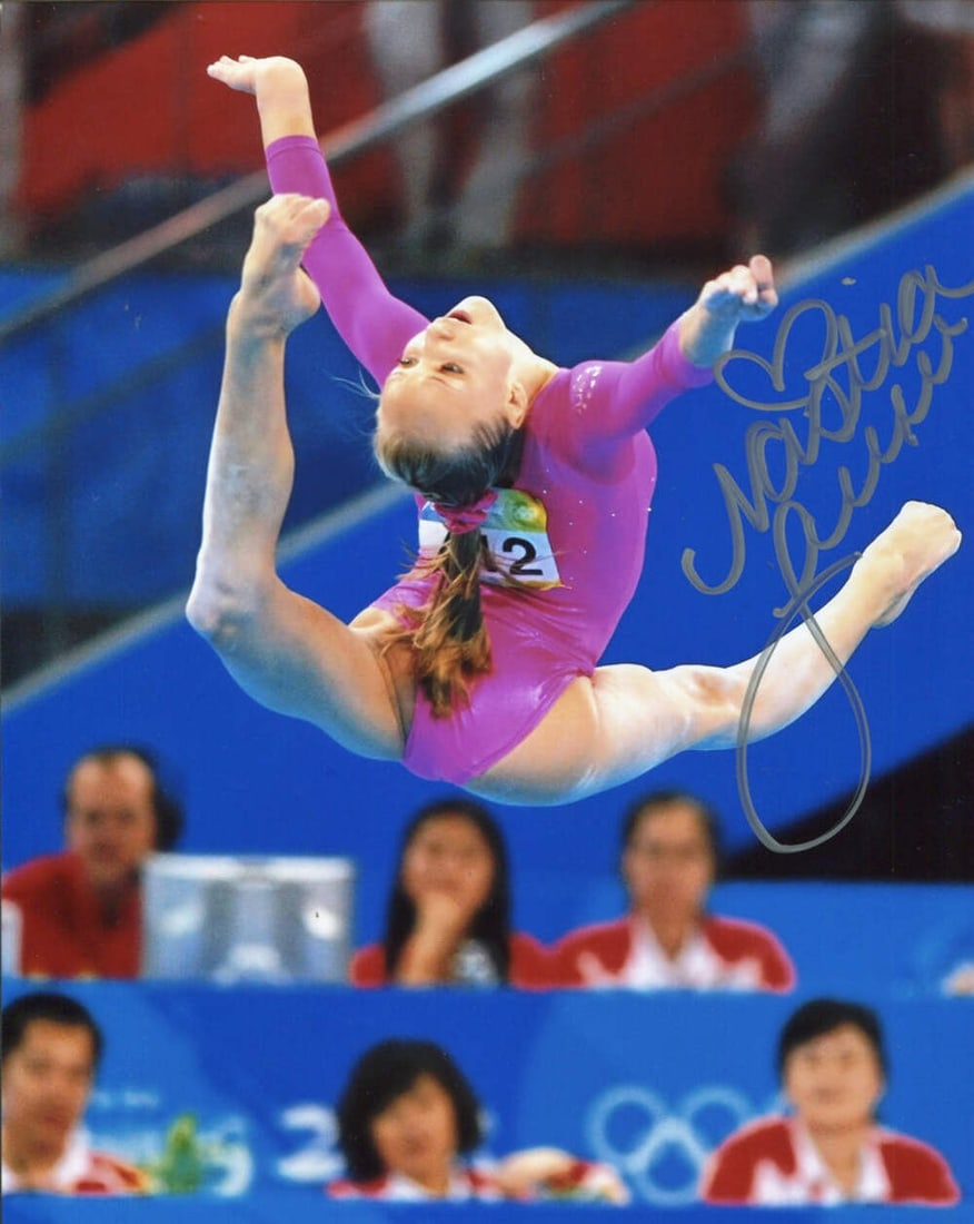 Nastia Liukin Autographed 8x10 Photo: Nastia Liukin Autographed 8x10 Photo Item Specifics: Signed in silver sharpie across the front of the photo Nastia is performing at the 2008 Beijing Olympics Item is authenticated by Rich Altman's