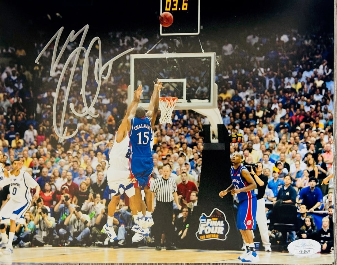Mario Chalmers Autographed 8x10 Basketball Photo (JSA): Mario Chalmers Autographed 8x10 Basketball Photo (JSA) Signed by Mario Chalmers in silver sharpie across the photo, this 8x10 basketball image captures a pivotal moment from the 2008 National Champion