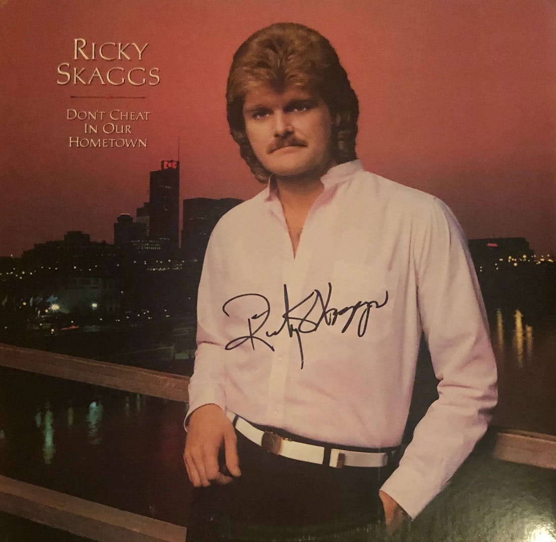 Ricky Skaggs Autographed "Don't Cheat in our Hometown" Vinyl Record (JSA): Ricky Skaggs Autographed "Don't Cheat in our Hometown" Vinyl Record (JSA) Authentic Ricky Skaggs Autographed Vinyl Record, bearing the signature of the renowned country music artist. This "Don't