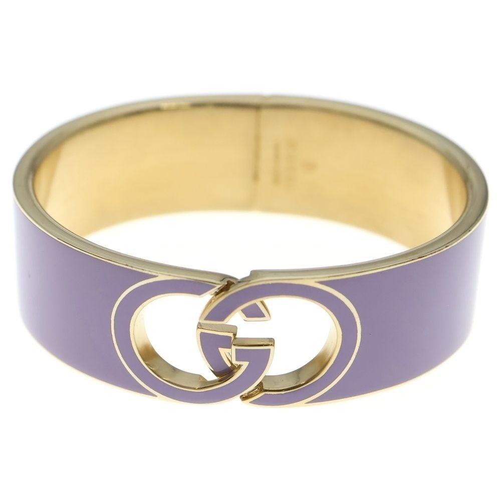 Gucci Interlocking G Lacquer Cuff bracelet bangle Purple and Gold Color: Gucci Interlocking G Lacquer Cuff bracelet bangle Purple and Gold Color Item Specifics: Color: Purple Material: Metal Brand: Gucci Type: Cuff Style: Bangle Product Disclaimer: Items may exhibit light