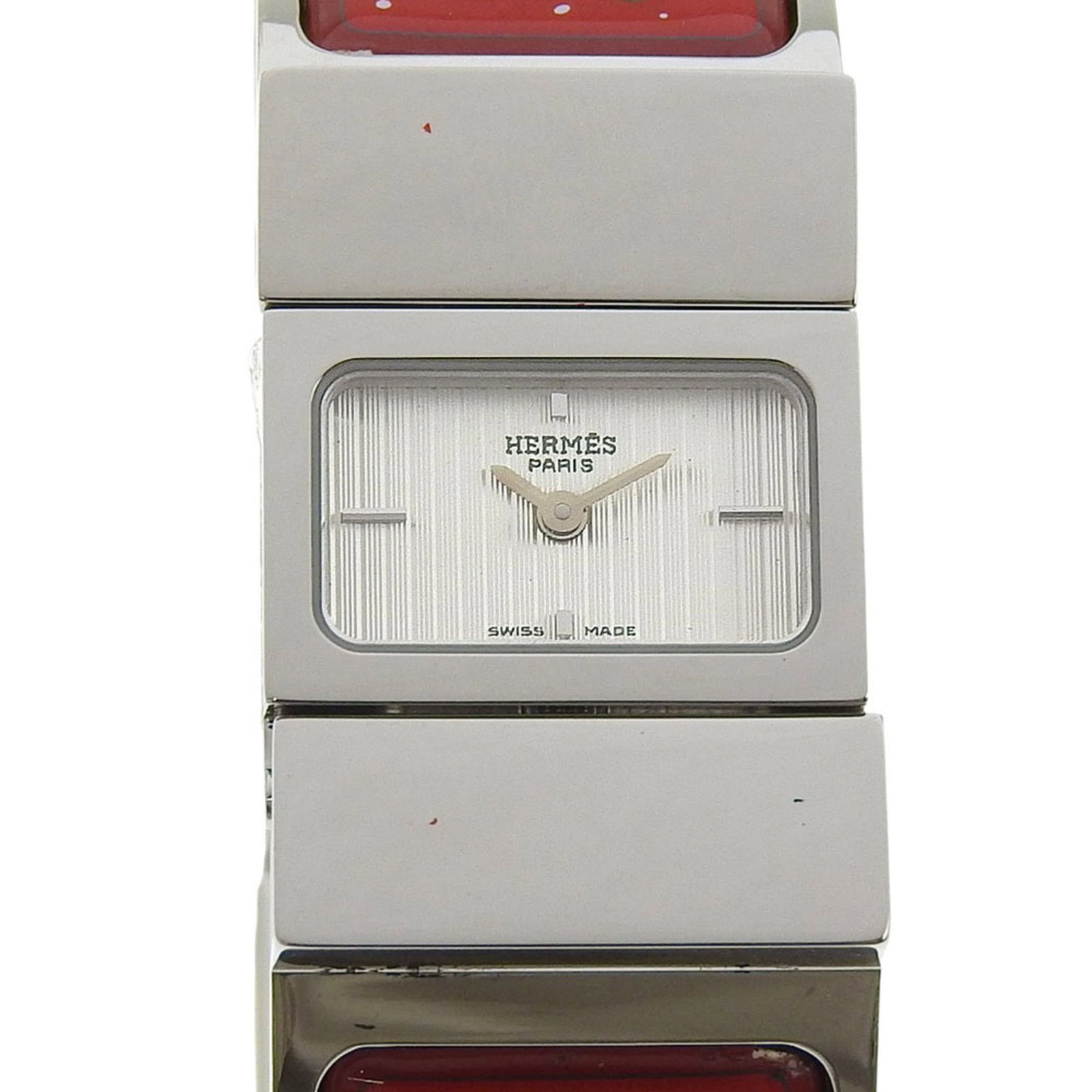 Hermes Wristwatch: Hermes Wristwatch Stainless steel case and band add an edgy touch to this white analog wristwatch, a classic design from Hermes. The watch features a 20mm diameter case and a comfortable 15.5cm strap