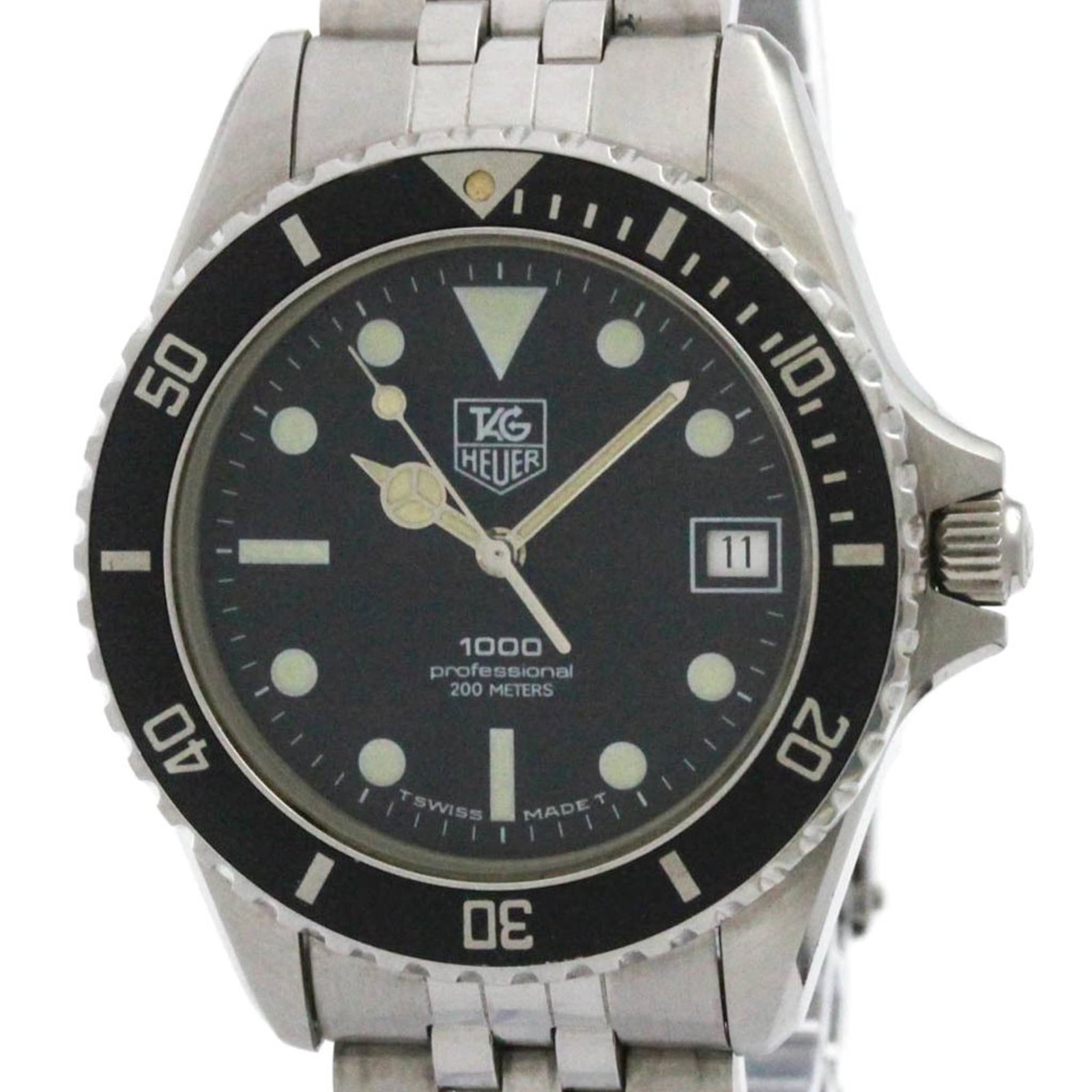 Tag Heuer Wristwatch: Tag Heuer Wristwatch Stainless steel case and band, the Tag Heuer wristwatch boasts a sleek black dial. Measuring 37mm in diameter, it's a sporty timepiece with a durable build. With traces of usage