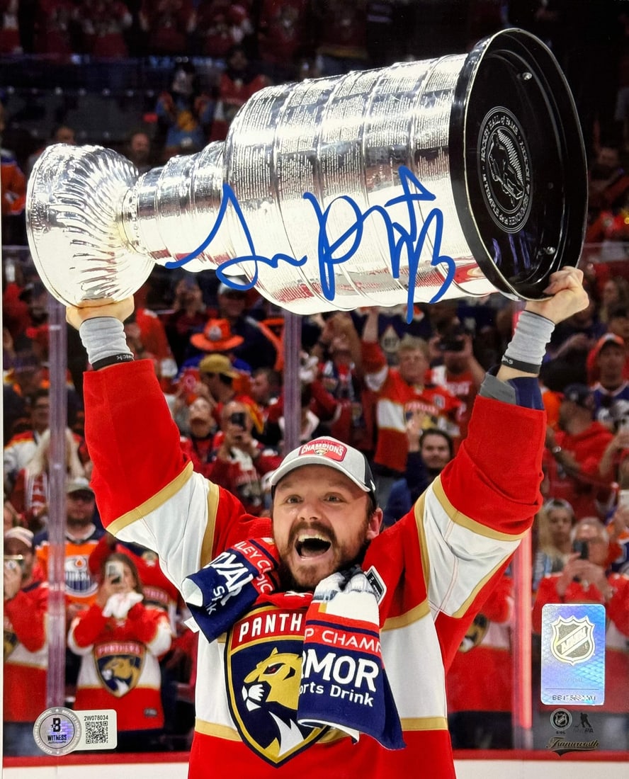 Stanley Cup Raising Sam Reinhart Autographed Panthers 8x10 Beckett Witness: Stanley Cup Raising Sam Reinhart Autographed Panthers 8x10 Beckett Witness Signed by Sam Reinhart in blue paint pen, the Stanley Cup Raising Panthers 8x10 Beckett Witness features an iconic moment fro
