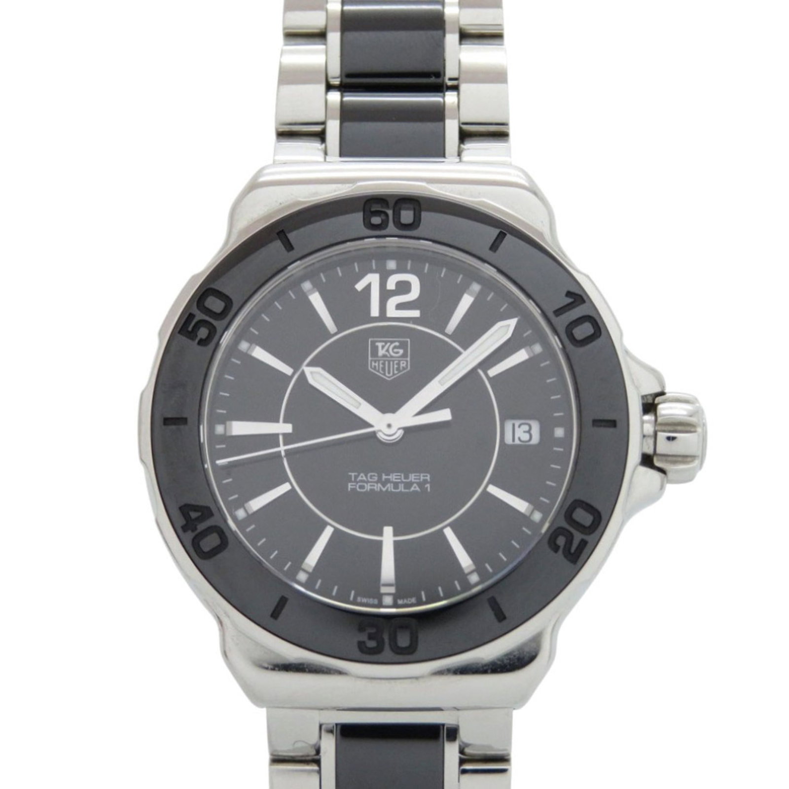 Tag Heuer Wristwatch: Tag Heuer Wristwatch Stainless steel case and band provide a durable foundation for this 34mm Tag Heuer wristwatch, suitable for everyday wear. The watch bears traces of usage, with minor scratches an