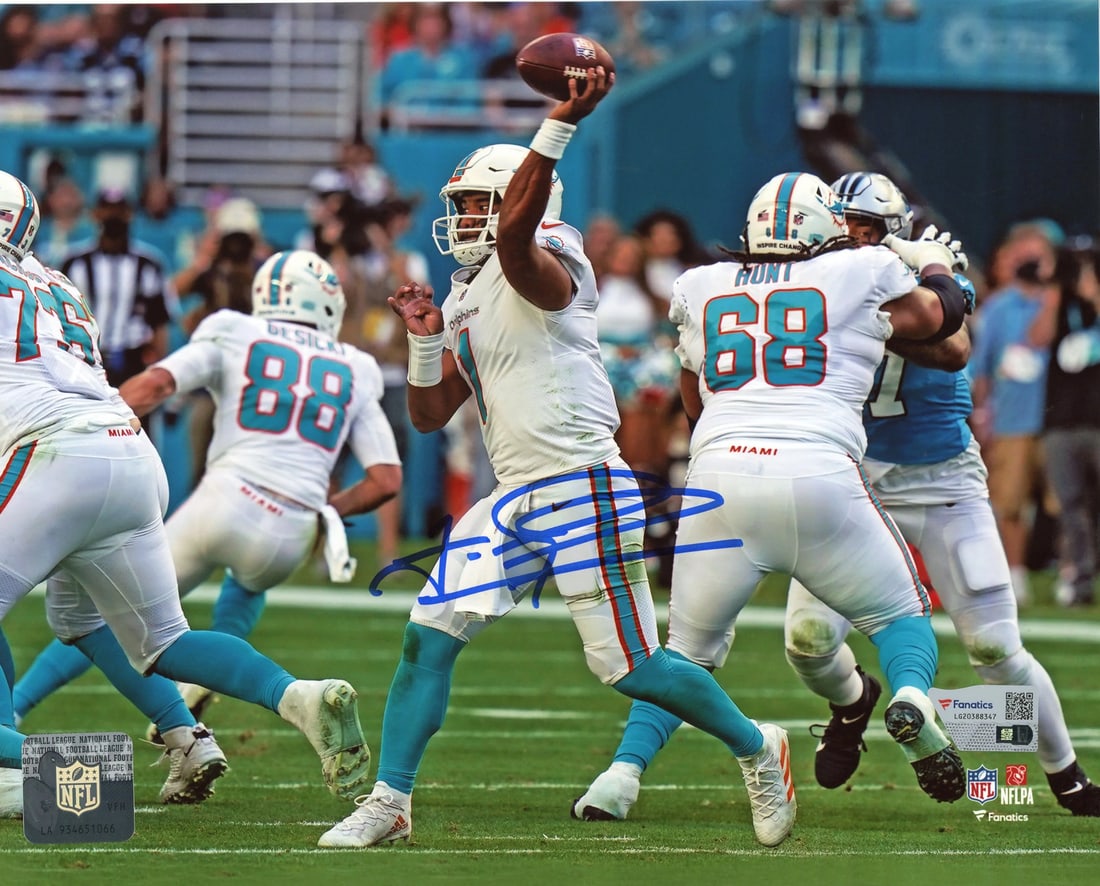 Tua Tagovailoa Autographed 8x10 Photo (Fanatics): Tua Tagovailoa Autographed 8x10 Photo (Fanatics) Signed by Tua Tagovailoa in blue sharpie across the front of an official 8x10 photo, this unique piece bears a distinctive mark from the NFL
