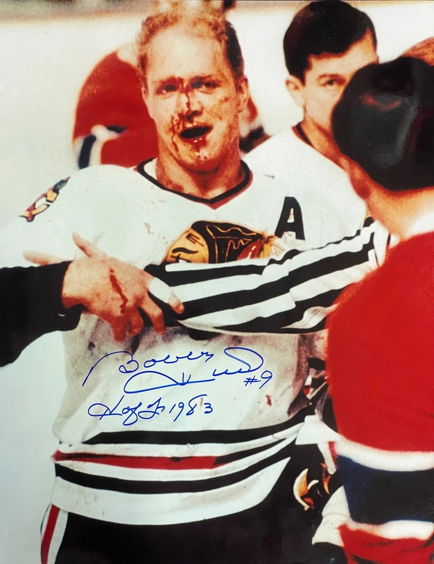 Bobby Hull Autographed 16x20 Hockey Photo: Bobby Hull Autographed 16x20 Hockey Photo Bobby Hull's iconic hockey career is showcased in this 16x20 signed photo, bearing his signature across the front in blue sharpie with a notable inscription. 