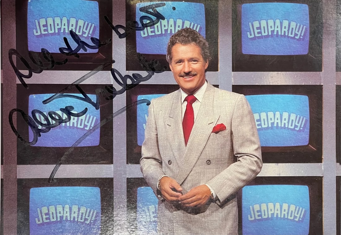 Alex Trebek Autographed Jeopardy 5x7 Promotional postcard (JSA): Alex Trebek Autographed Jeopardy 5x7 Promotional postcard (JSA) Signed in black sharpie across the front of the postcard with inscription "All The Best" by Alex Trebek, this 5x7 promotional Jeopardy p