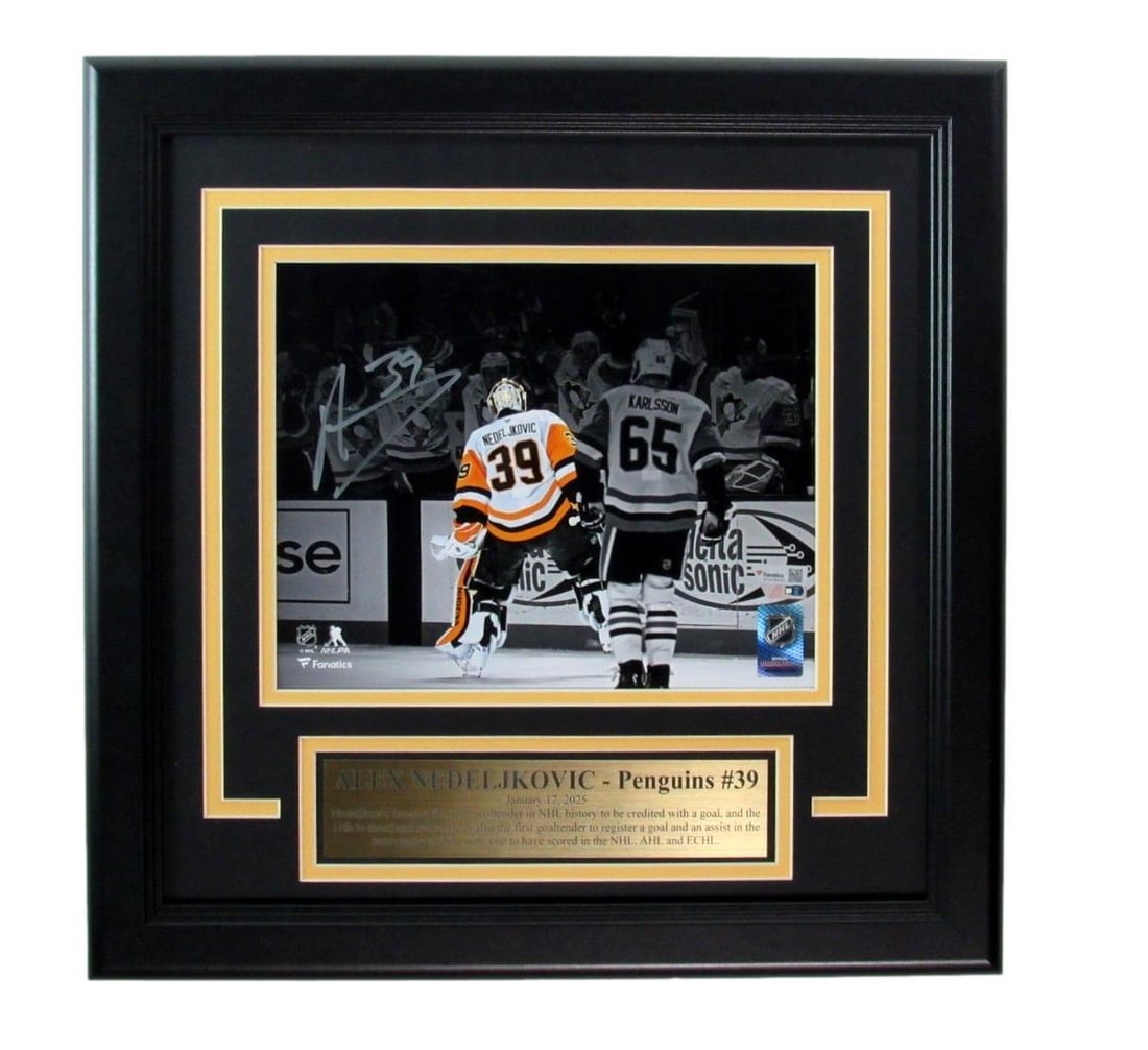 Signed photo of penguins framed with insc fanatics 194616 by Alex Nedeljkovic: Signed photo of penguins framed with insc fanatics 194616 by Alex Nedeljkovic Signed photo of penguins framed by Alex Nedeljkovic, featuring the goalie's signature on an in-game action shot. The item 