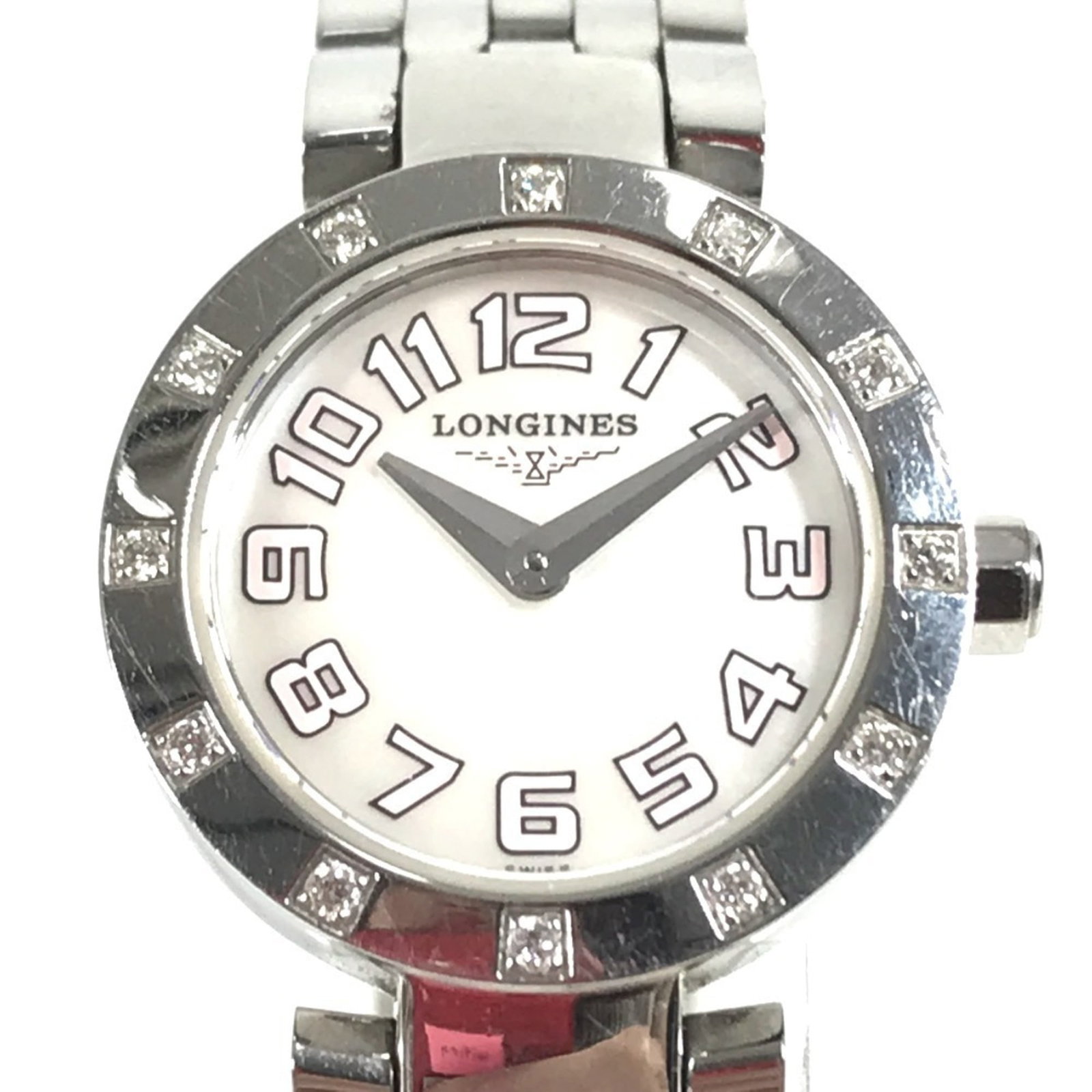 Longines Wristwatch: Longines Wristwatch Stainless steel case and band, the Longines wristwatch features a white dial. With a diameter of 20mm, it's designed to fit wrists up to 15cm in size. A few traces of usage are