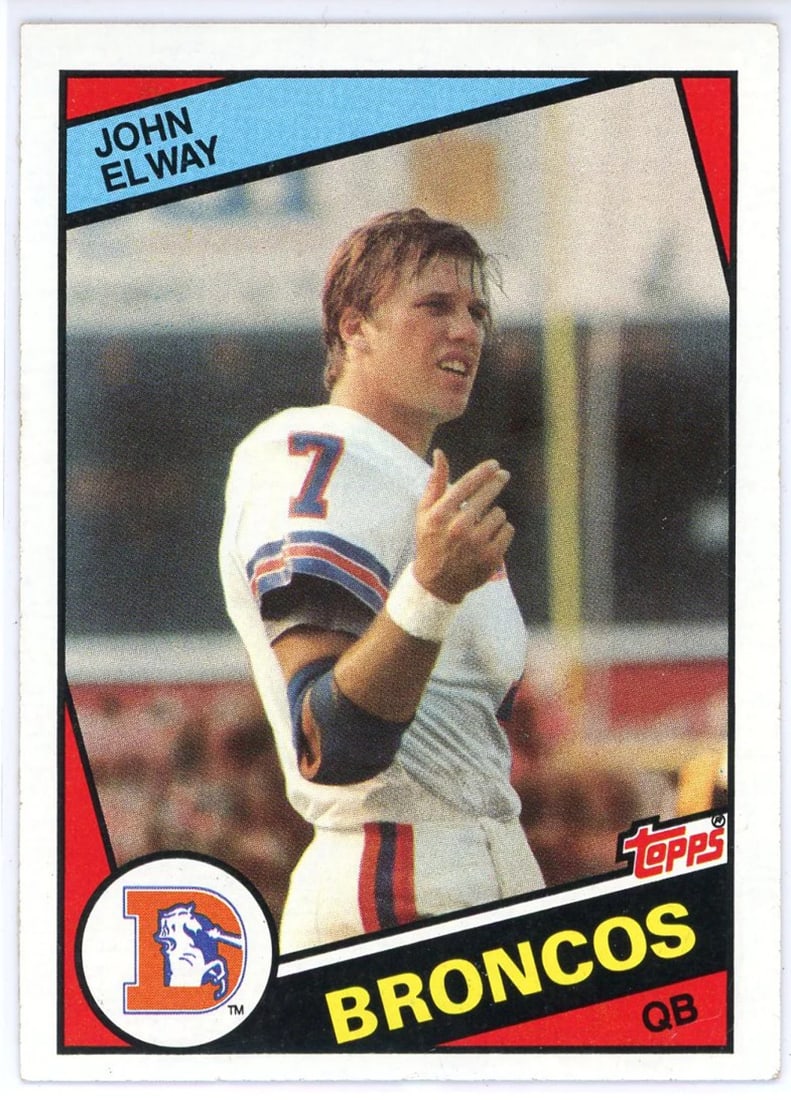 Elway John 1984 Topps Card Rookie #63: Elway John 1984 Topps Card Rookie #63 Topps John Elway 1984 Rookie Card #63. This card features the rookie debut of NFL legend John Elway, one of the most iconic players in sports history. Printed by 
