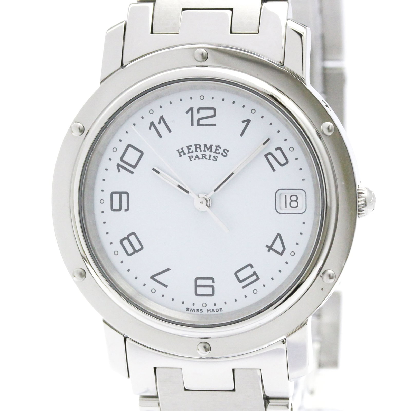 Hermes Wristwatch: Hermes Wristwatch Stainless steel case and band, white dial, and a classic 36mm design make this Hermes wristwatch a timeless piece. The watch bears some signs of usage, with a few scratches and dirt 