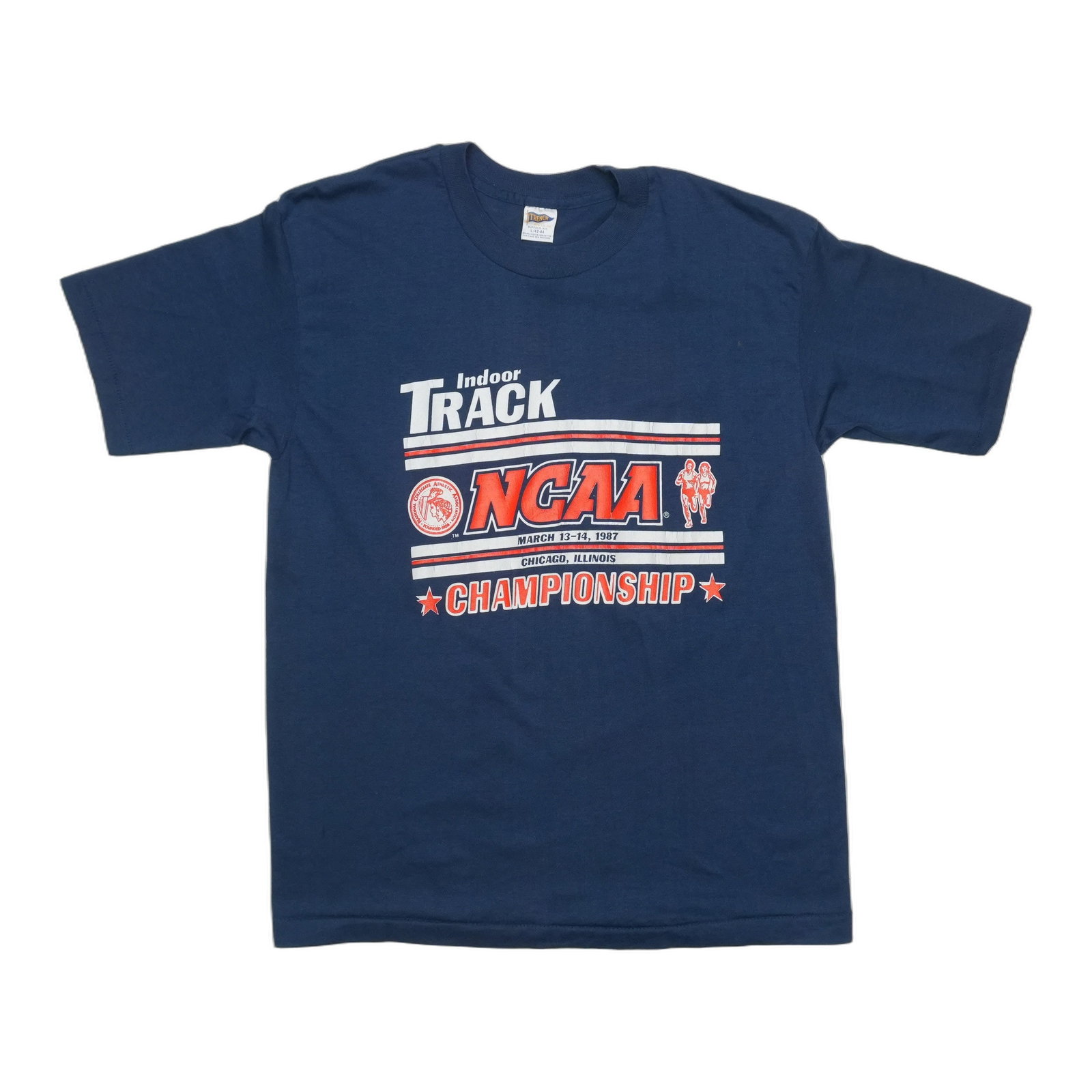 NCAA Track Shirt 1987 Indoor Championship: NCAA Track Shirt 1987 Indoor Championship Large, blue 1987 NCAA Indoor Track Championship Shirt with front graphic. This vintage shirt features a size large fit and measures 18" pit to pit, 26" collar